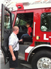 Firefighter Showing Boy Fire Truck 2