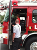 Firefighter Showing Boy Fire Truck